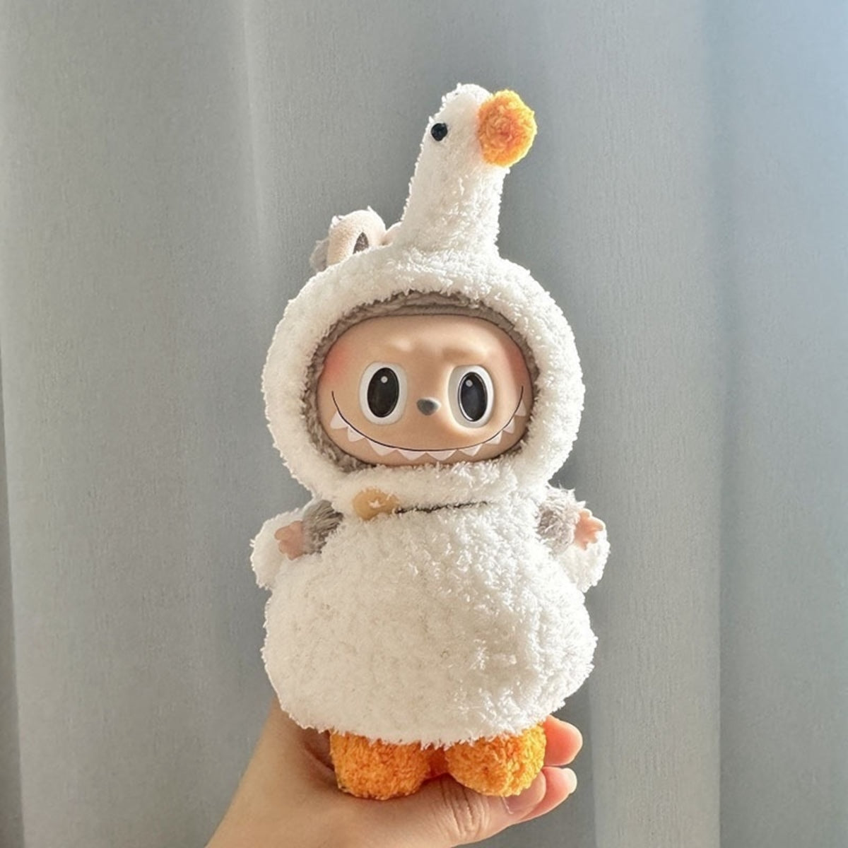 Transform your Labubu doll into a quacky cutie with this handmade Cute Duck costume outfit! Compatible with Labubu versions 1, 2, and 3, this outfit ships worldwide with fast shipping. Labubu figure not included. Let your Labubu stand out with this unique and adorable costume!, Cute-Duck-costume_style_-_Handmand_Labubu_Doll_Outfit