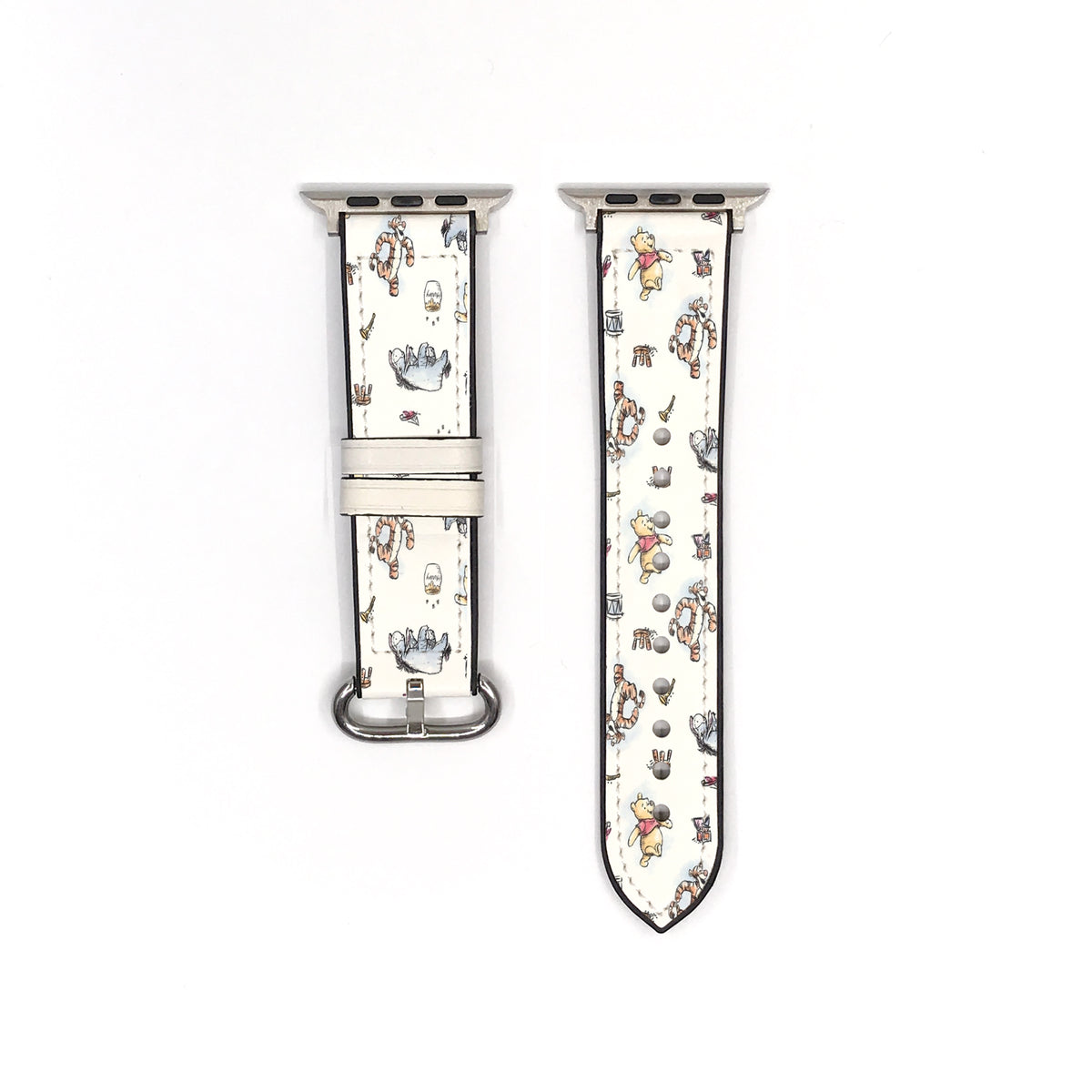 Vintage-style Winnie the Pooh Apple Watch band showing both strap pieces and silver-tone fastening hardware.