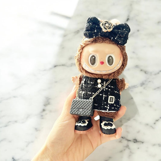 Introducing the Black Dress Style - Handmand Labubu Doll Outfit. With its fancy black dress and cute matching bag, this outfit is sure to make your Labubu version 1, 2, or 3 stand out. Enjoy fast worldwide shipping for this labubu outfit. Please note: Labubu figure not included., Black Dress Style - Handmand Labubu Doll Outfit