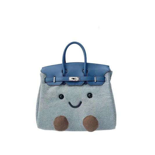 Kawaii denim plush character satchel handbag in cobalt blue – front view with embroidered face