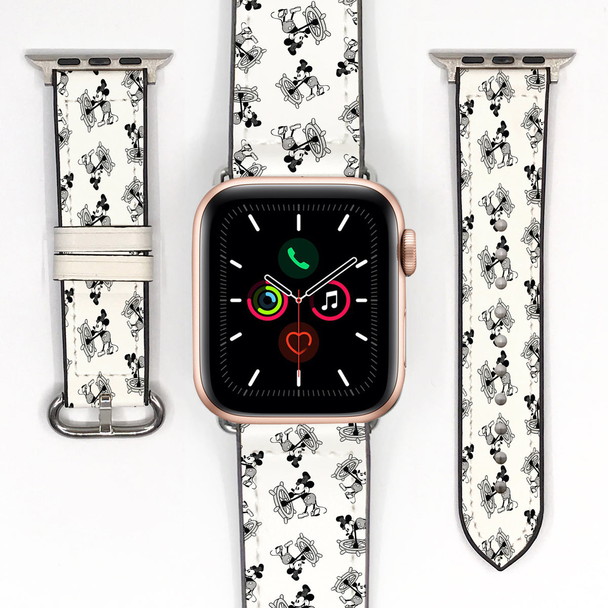 Black and white cartoon-print Apple Watch strap displayed with a smartwatch