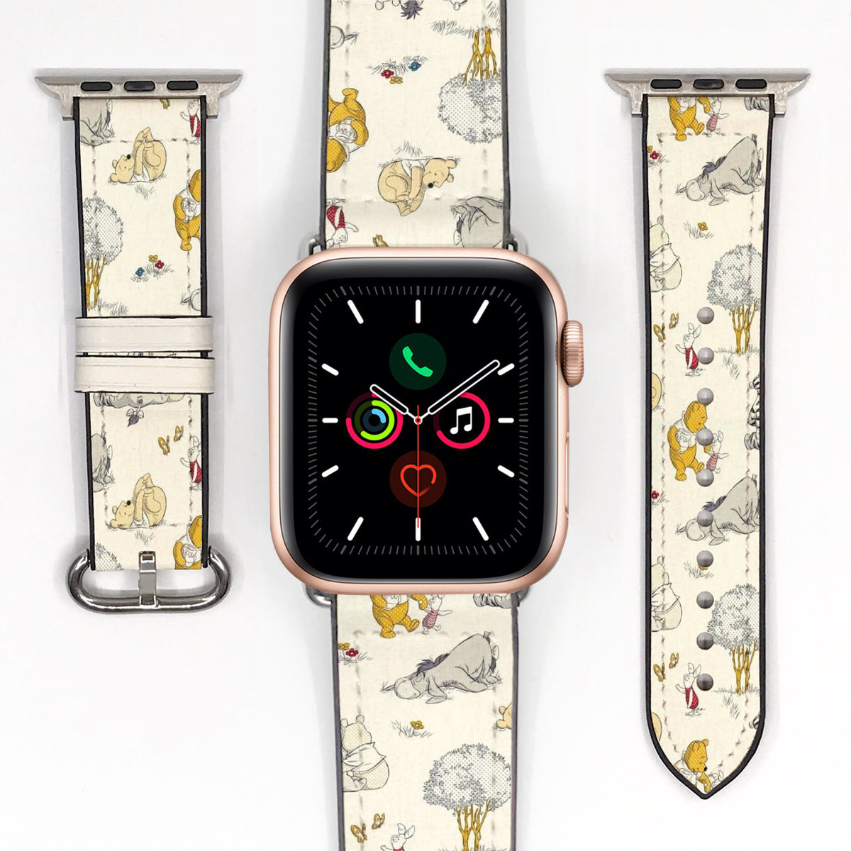 Vintage-inspired Winnie the Pooh Apple Watch band displayed with the watch and both strap pieces on a white background.