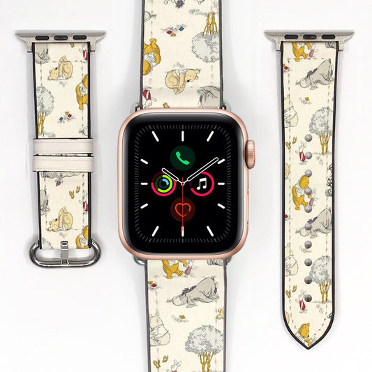 Vintage-inspired Winnie the Pooh Apple Watch band displayed with the watch and both strap pieces on a white background.