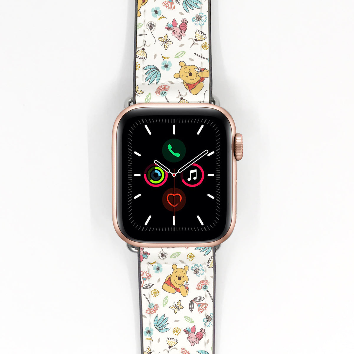 Cream Winnie the Pooh floral Apple Watch band displayed on a rose gold smartwatch.