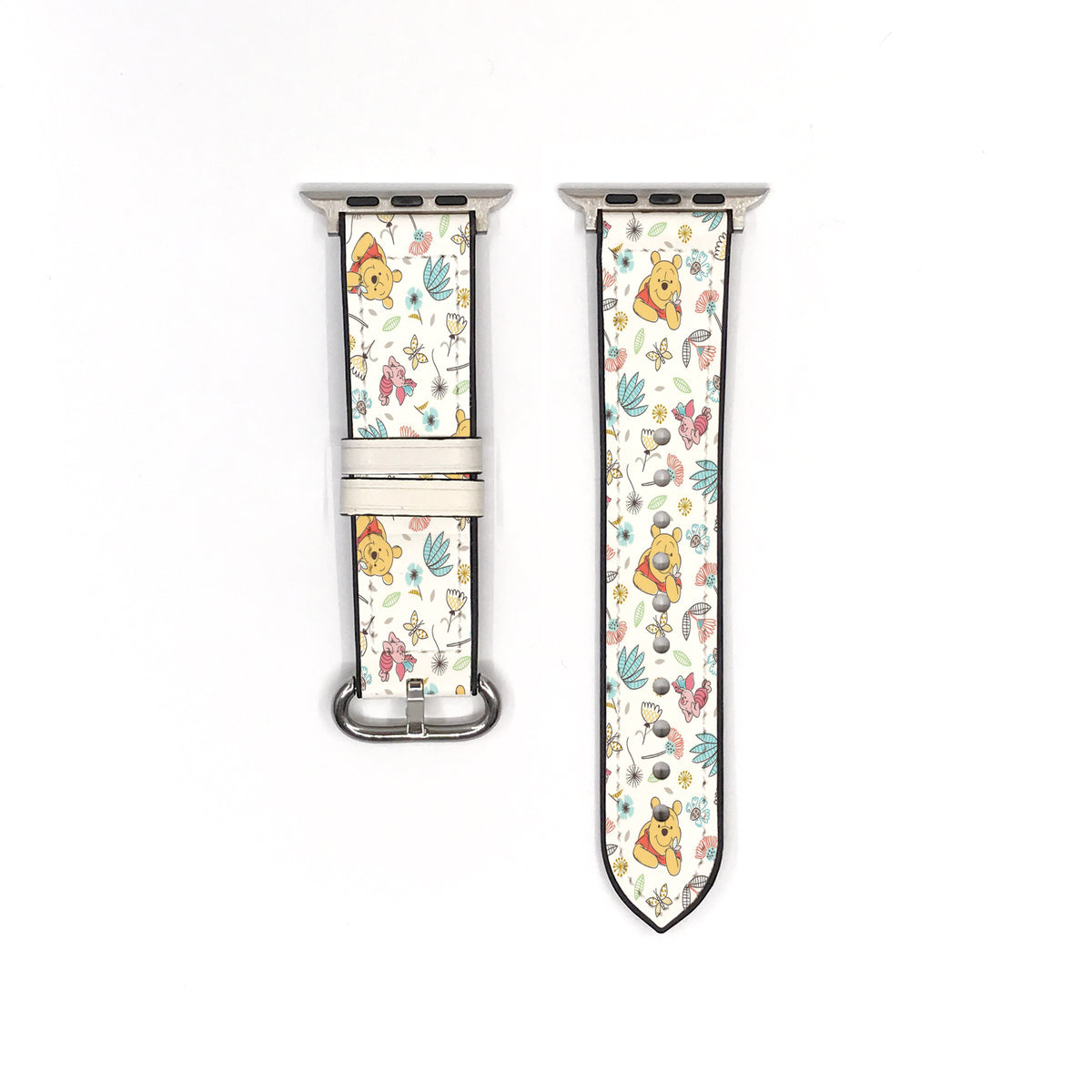 Cream floral cartoon Apple Watch band showing both strap pieces and silver-tone fastening hardware.