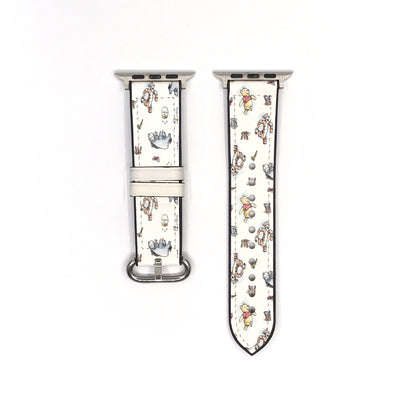 Vintage-style Winnie the Pooh Apple Watch band showing both strap pieces and silver-tone fastening hardware.