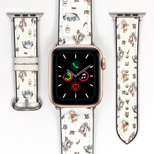 Cream cartoon character Apple Watch band displayed with the watch and both strap pieces on a white background.