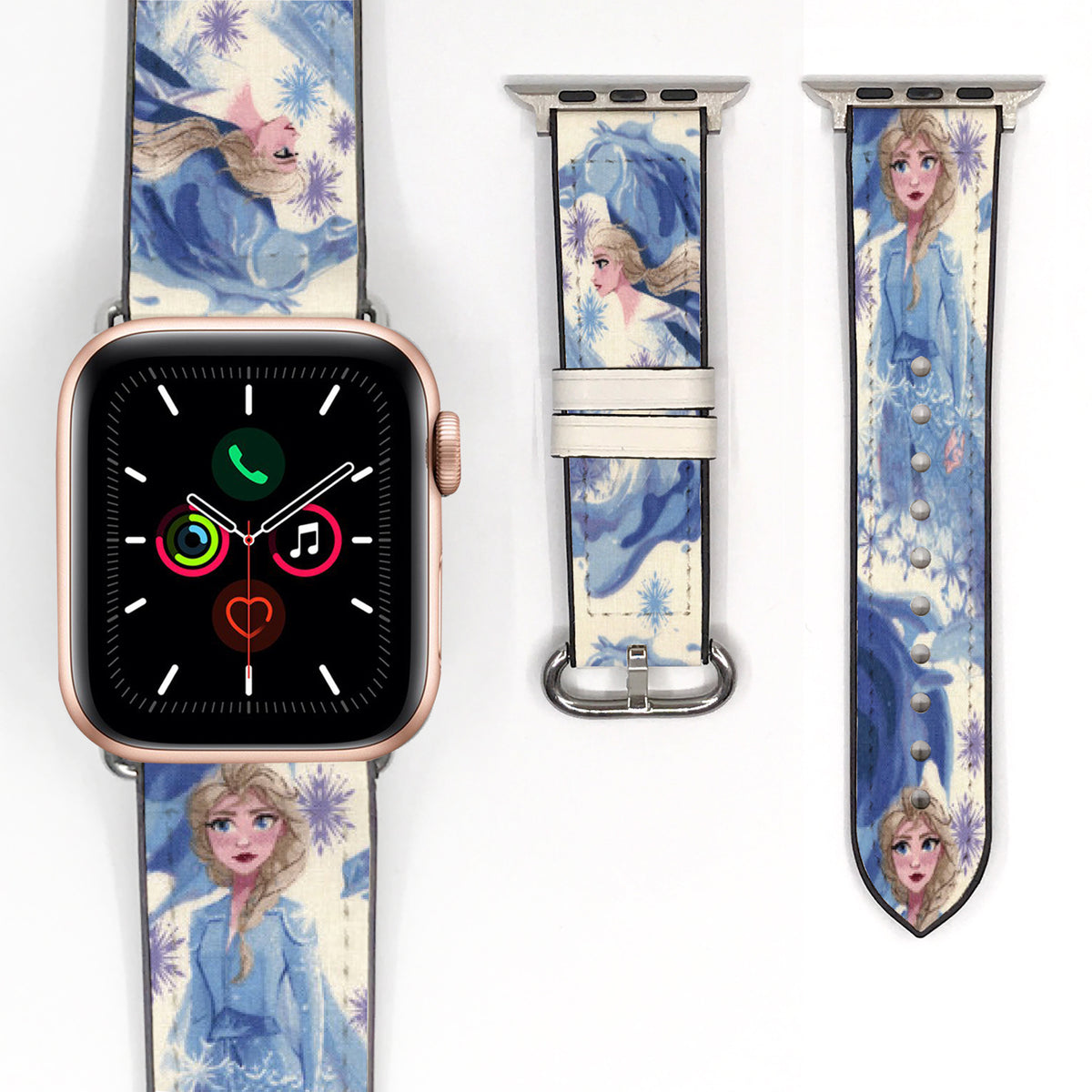 Close-up of a blue Elsa Apple Watch band featuring character illustrations and purple snowflake patterns.