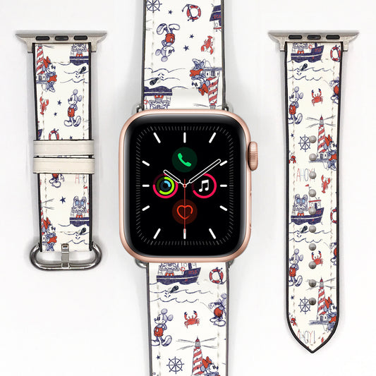 Close-up of a red and navy nautical character Apple Watch band with silver-tone connectors and fastening hardware.