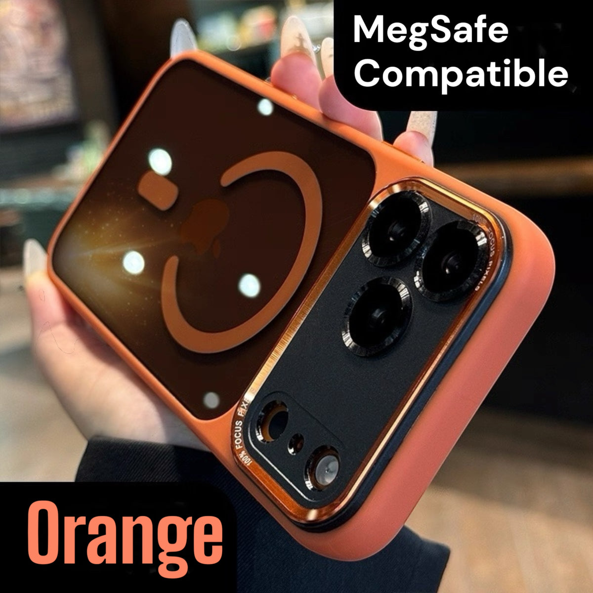 Orange iphone 17 pro max case with a smiley face design held by a hand, labeled 'MegSafe Compatible'.