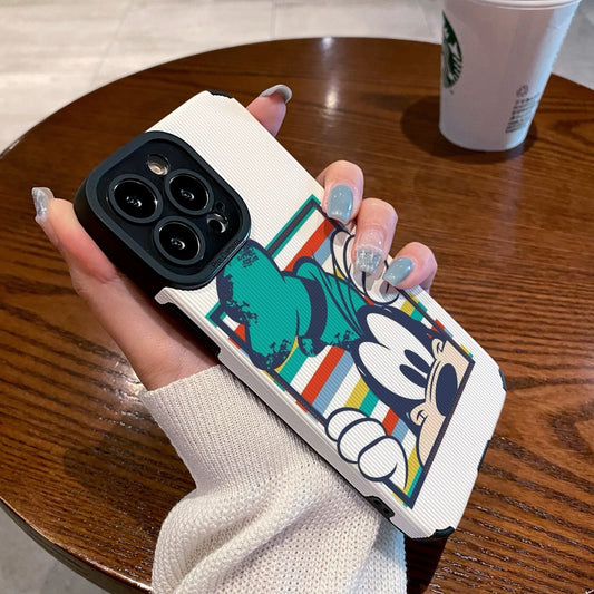 iPhone case with Goofy design held by a person on a wooden table with a Starbucks cup in the background