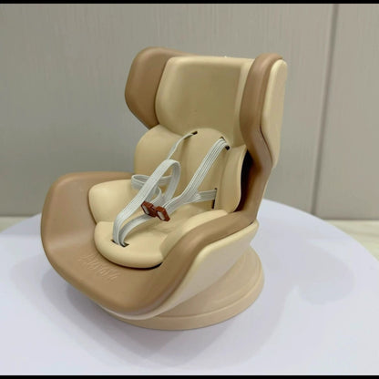 Beige child car seat on a white surface with a neutral background