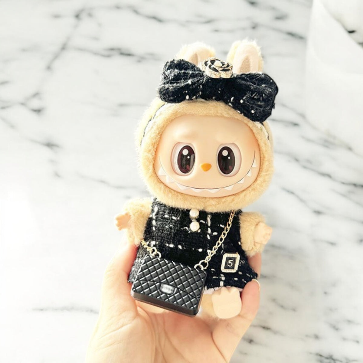 Introducing the Black Dress Style - Handmand Labubu Doll Outfit. With its fancy black dress and cute matching bag, this outfit is sure to make your Labubu version 1, 2, or 3 stand out. Enjoy fast worldwide shipping for this labubu outfit. Please note: Labubu figure not included., Black Dress Style - Handmand Labubu Doll Outfit