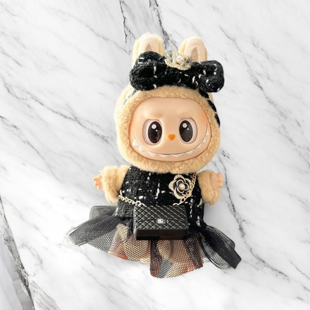 Introducing the Black Dress Style - Handmand Labubu Doll Outfit. With its fancy black dress and cute matching bag, this outfit is sure to make your Labubu version 1, 2, or 3 stand out. Enjoy fast worldwide shipping for this labubu outfit. Please note: Labubu figure not included., Black Dress Style - Handmand Labubu Doll Outfit