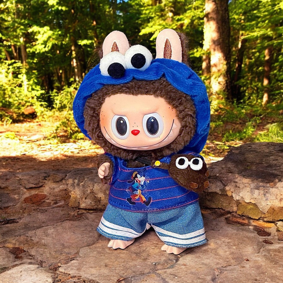 A Blue Cookie Monster Costume outfits on Labubu 17cm Doll with forrest background
