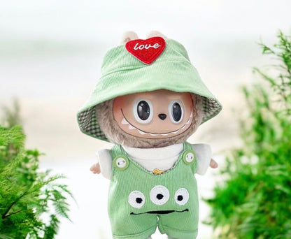 Toy figure with a green hat and overalls standing outdoors