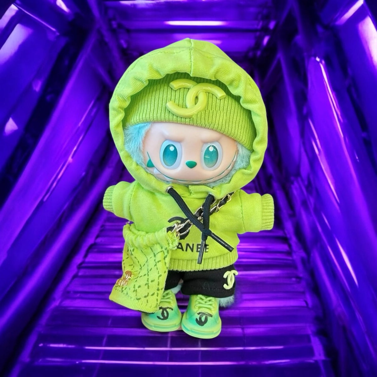 Toy figure in a bright green outfit with a hood, standing on a reflective purple surface.