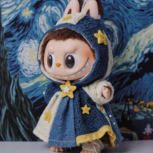 Toy figure Labubu wearing in a blue hooded cloak with star decorations against a Van Gogh painting background